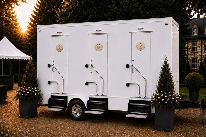 The Belgrave three-station luxury restroom trailer set at an estate