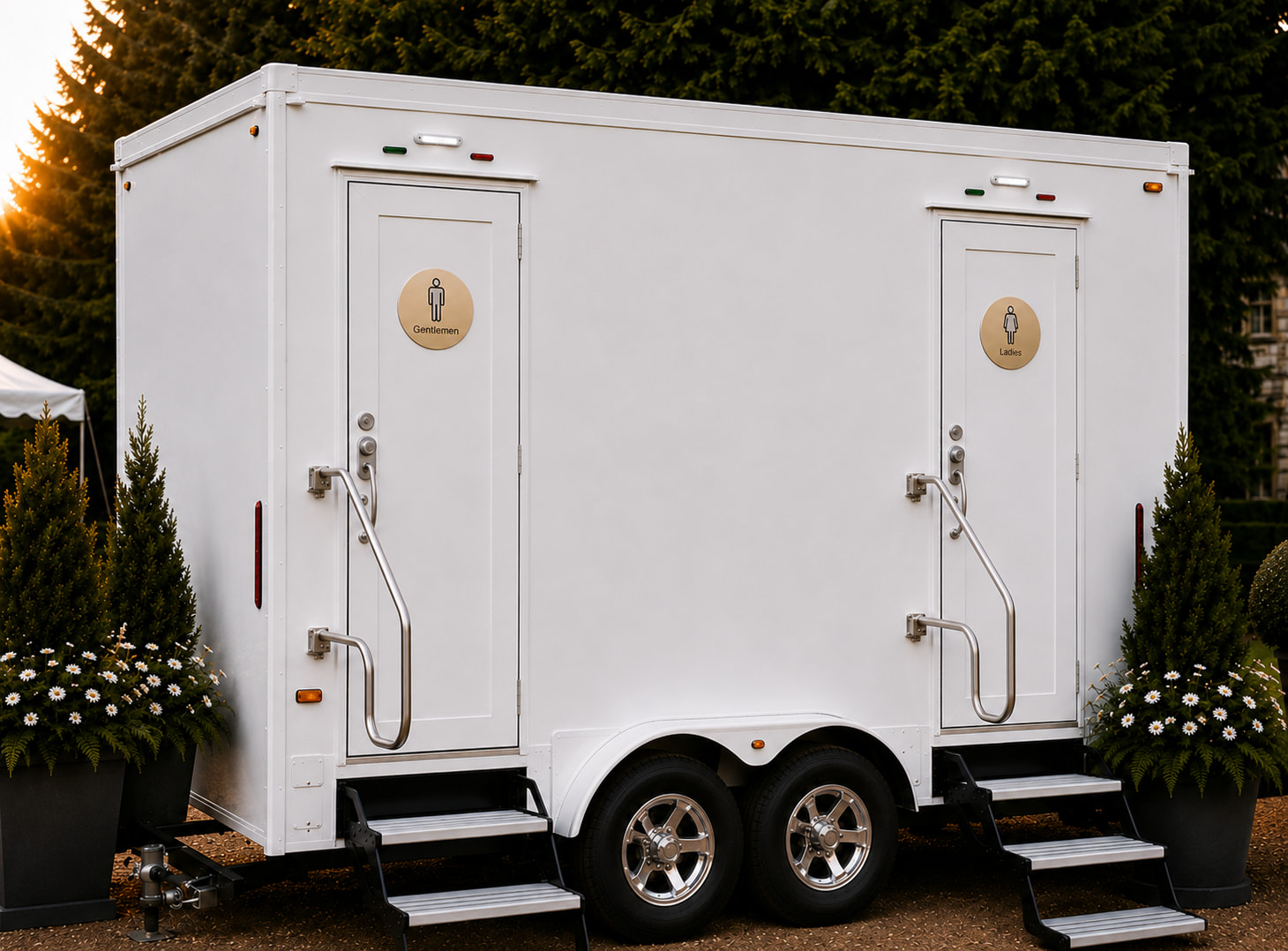 The Mayfair two-station luxury restroom trailer set on a gravel drive at golden hour