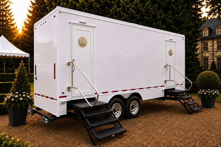 The Regent six-station luxury restroom trailer alongside an estate lawn